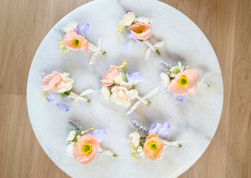 Elegant Peach Boutonniere with Blue & Ivory Details