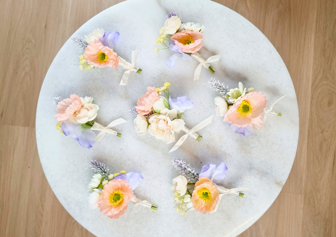 Elegant Peach Boutonniere with Blue & Ivory Details