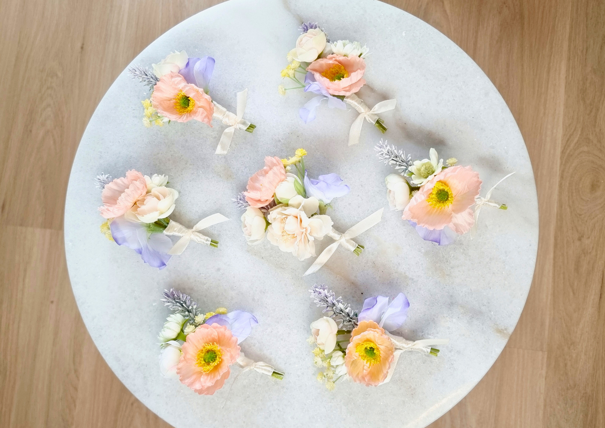 Elegant Peach Boutonniere with Blue & Ivory Details