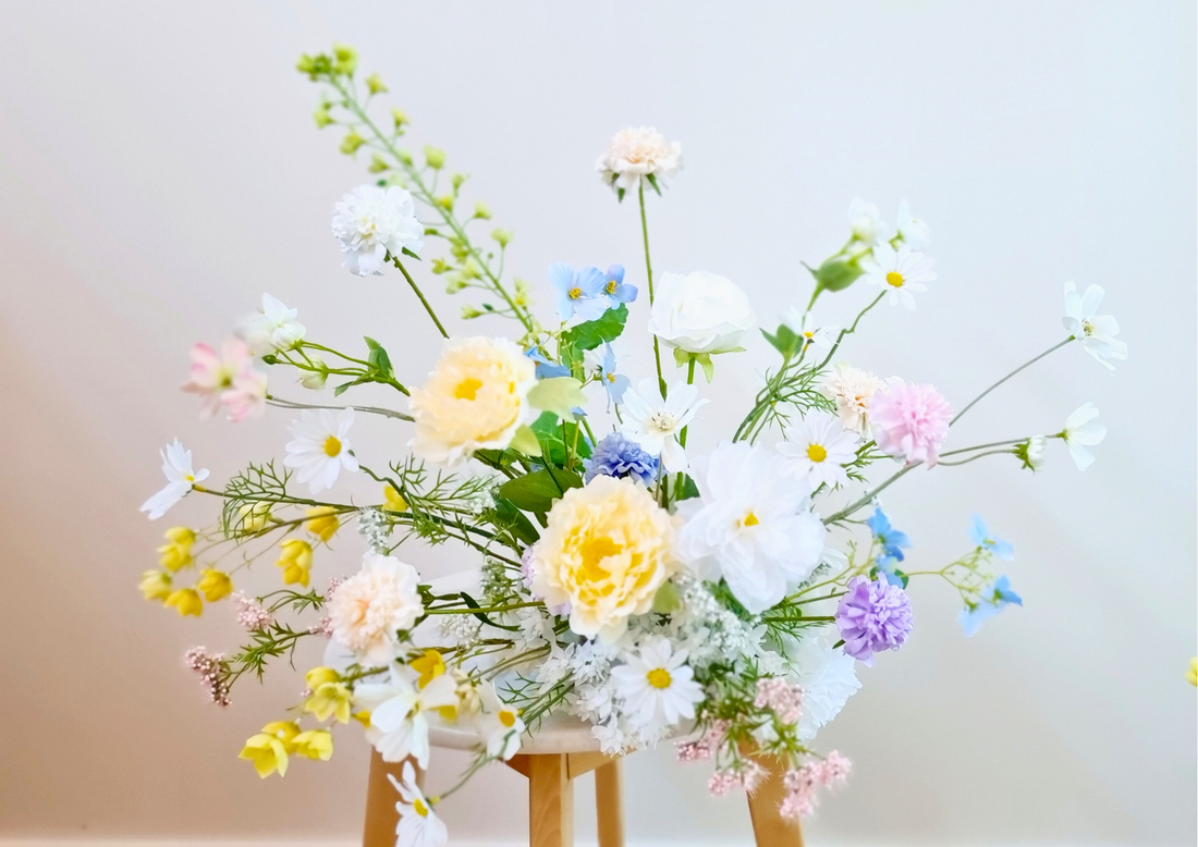 Vienna style arrangement in neutral tones with a bold pop of colour.