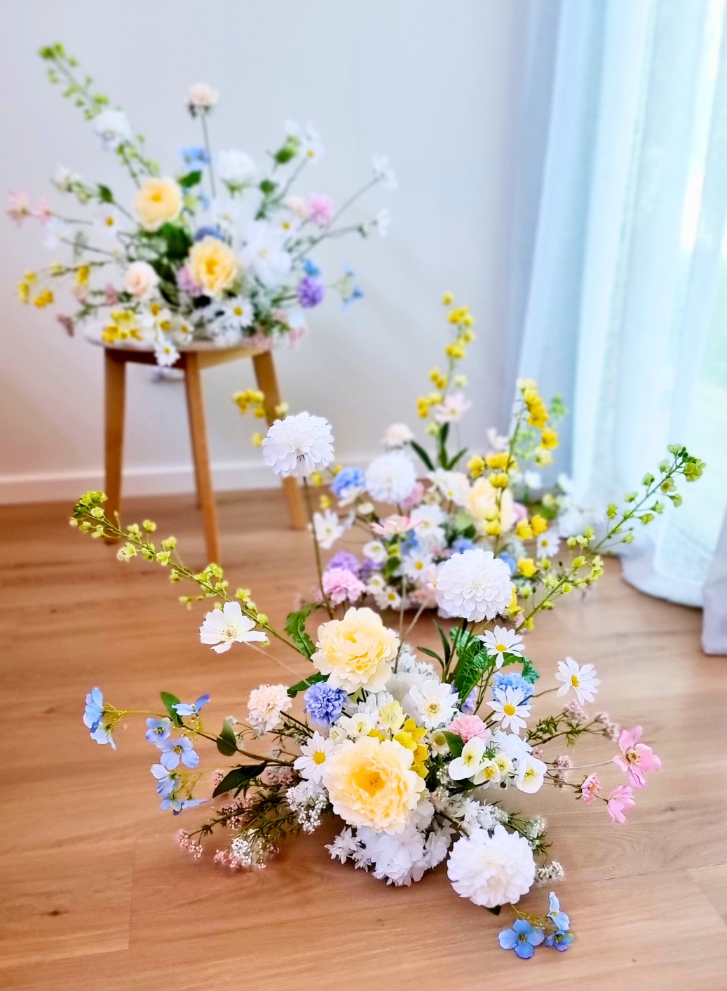 Vienna style arrangement in neutral tones with a bold pop of colour.