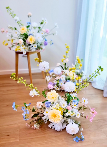 Vienna style arrangement in neutral tones with a bold pop of colour.