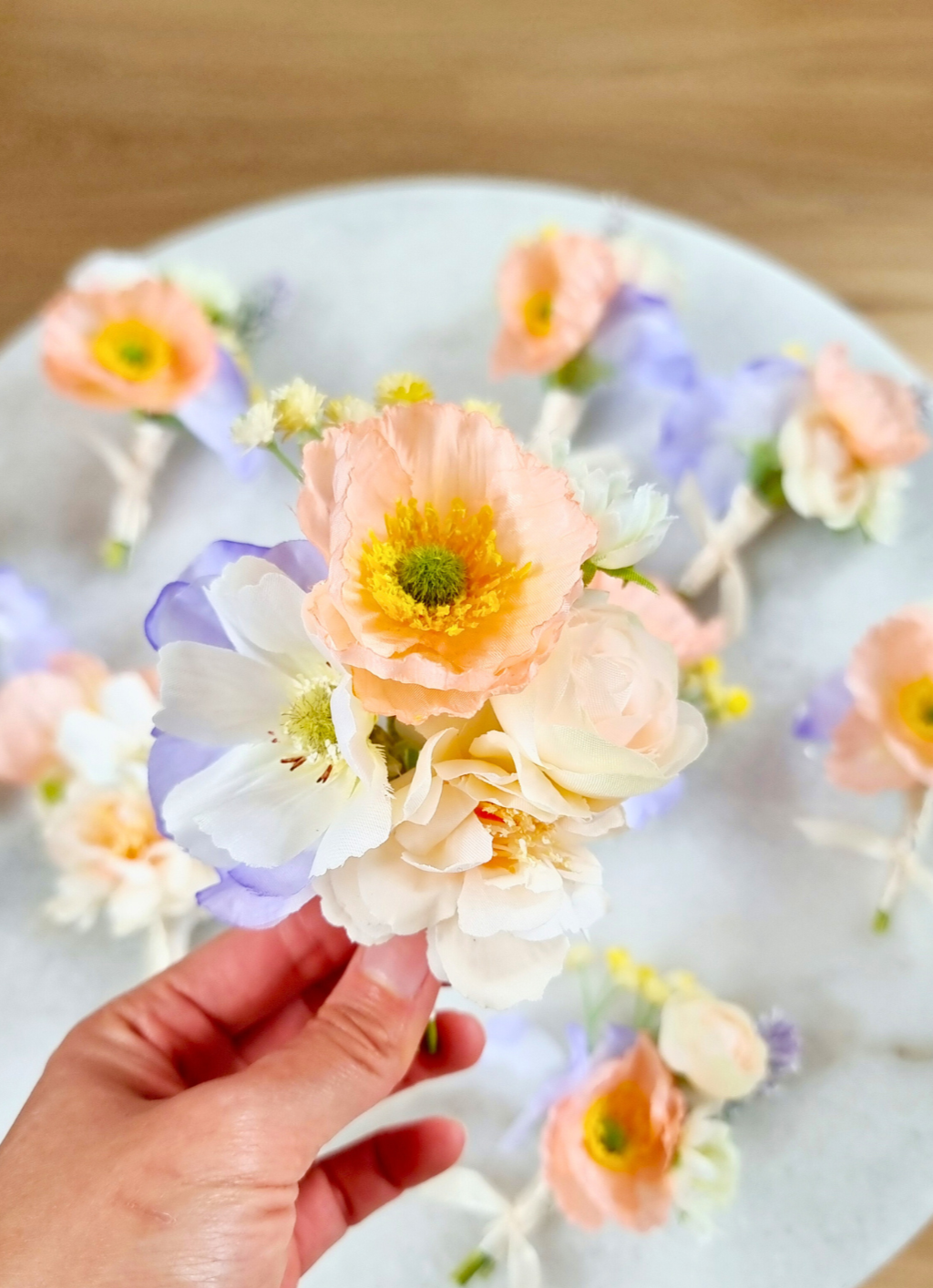 Elegant Peach Boutonniere with Blue & Ivory Details