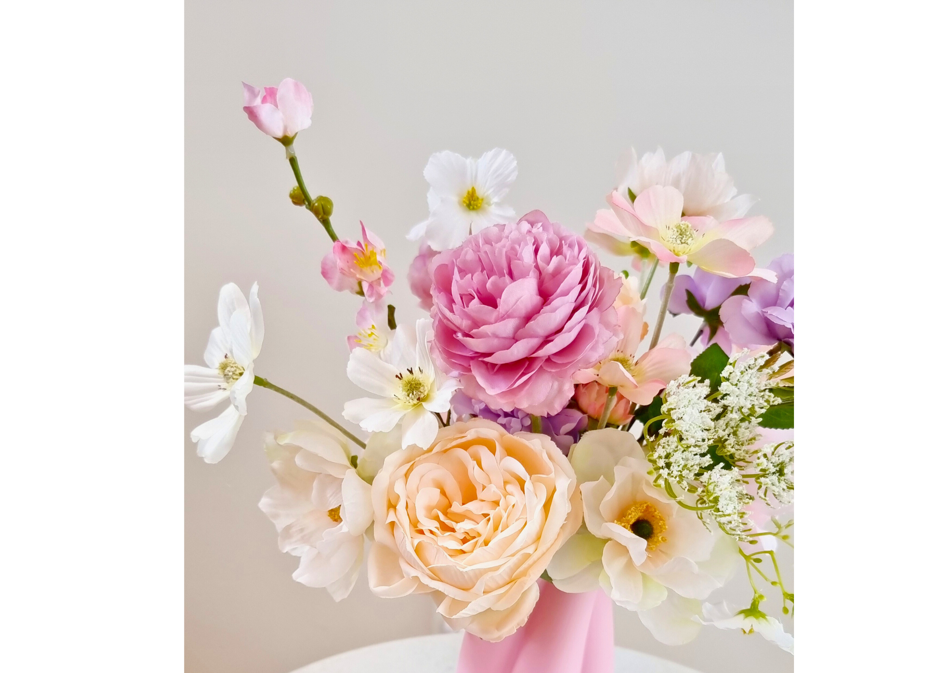 Graceful Romantic Peach heather flowers bouquet in a chic pink vase