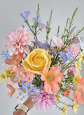 A Whimsical bouquet of pastel wildflowers and roses